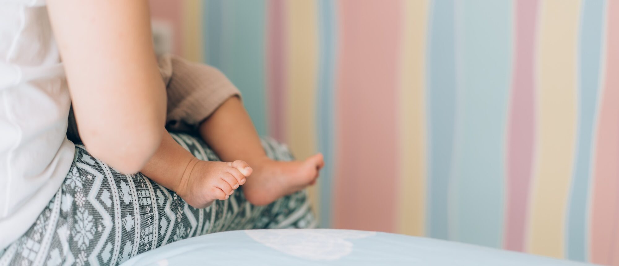 Young mother is breastfeeding her baby. In Vitro Fertilization IVF . Family of asians
